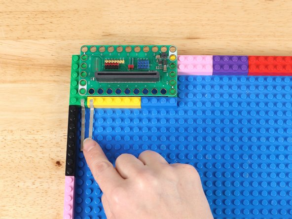 Stick Maker Tape on to LEGO baseplate with the ends going to Pin 0 and the GND Pin  right next to it.