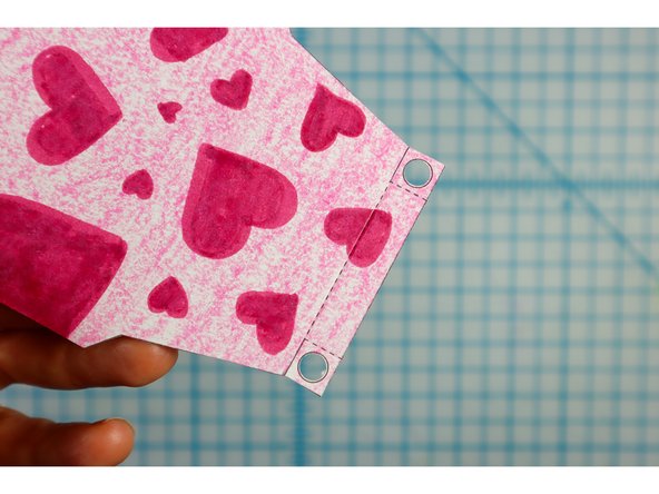 Use a standard hole punch to punch out the circles where shown.