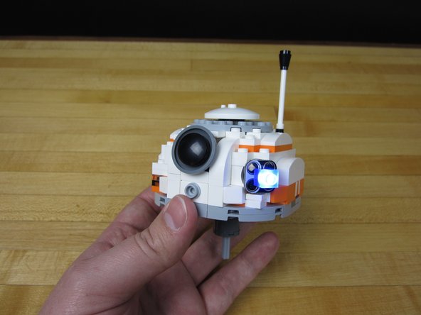 Connect your LED. (If it doesn't turn on, rotate it. You probably have it put on backwards compared to you battery holder.)