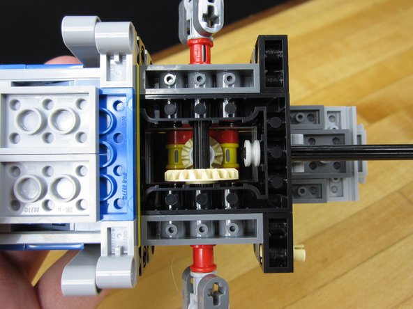 Carefully, and with some luck, get a 1/2 Brush onto the end of the axel.