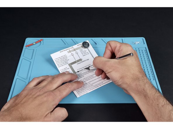 Using an X-ACTO/Craft knife, cut the two small vertical slits shown between paths &quot;d&quot; and &quot;e&quot;. Be careful to maintain the paper gap between them.