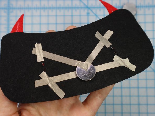 Place a piece of Maker Tape on top of each leg to make a secure connection.