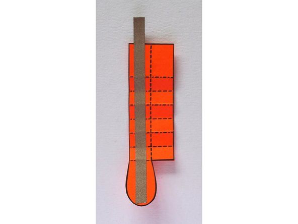 Fold the piece of tape hanging off onto itself to form a tab.