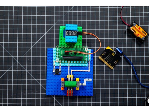 Connect a USB cable to the micro:bit and then plug it into your computer.