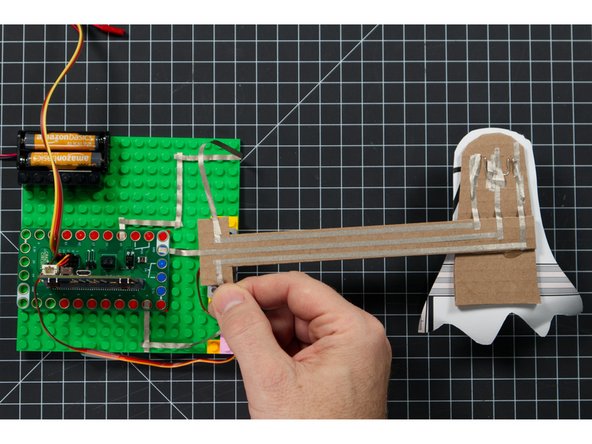 It may take a few attempts to get the length just right and stick down the tape to a position where it can move freely and not short the connection.