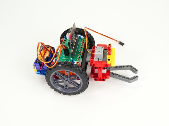 Just use the pins sticking out the back of the Gripper to attach to the front beam on the Rover.