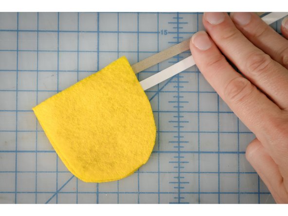 It's important that the two long pieces of Maker Tape exit the sensor on the same side, but do not touch each other.