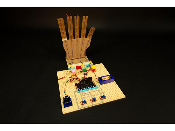 As you turn the potentiometers the fingers should start to close. If you turn the potentiometers back the fingers should return to an extended position.