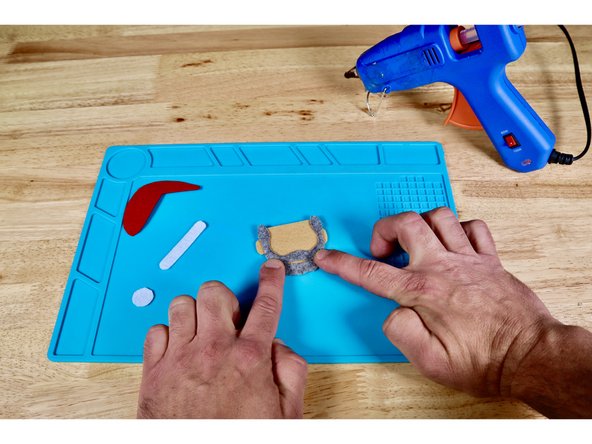 Flip and press the beard into place atop the face as shown.