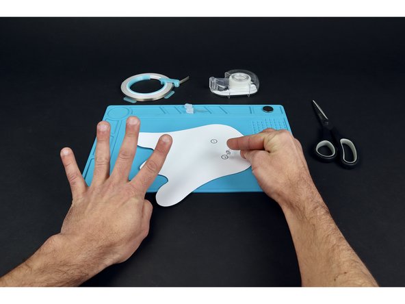 Use a pushpin to poke 4 holes where shown within the two circles that indicate where LEDs will be placed.