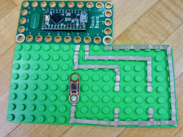 Following the diagram, connect &quot;A &amp; B&quot; buttons to the Invention Board.