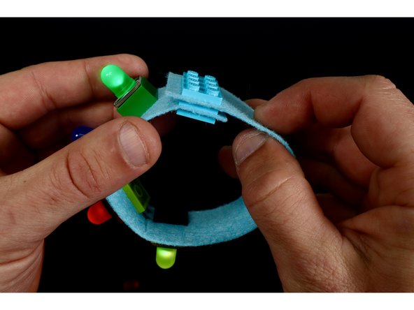 To create the LEGO clasp/closure. You will need to focus attention on those last two punched rectangles at the opposite ends of your bracelet.