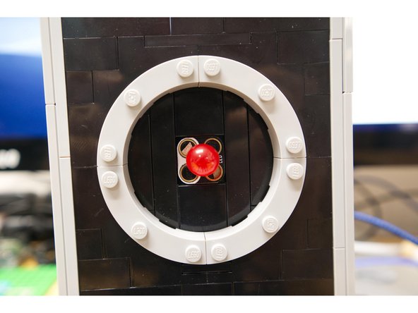 The LED connects to the micro:bit with Maker Tape running through to the back of HAL.