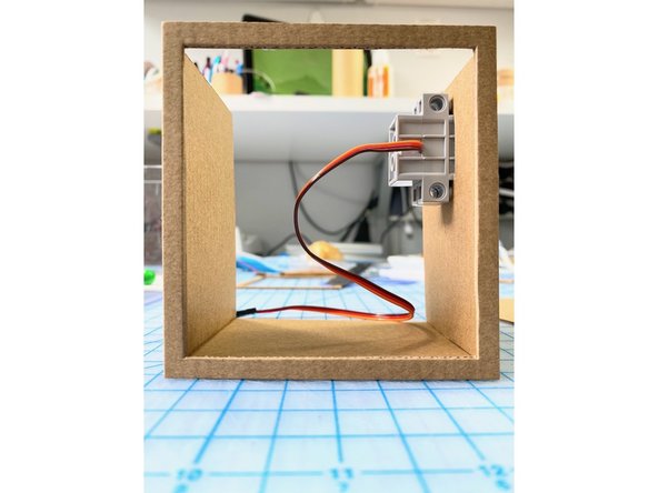 On the right side, we cut out a place for the servo to attach to the moving arm.