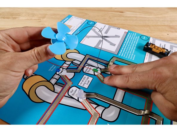 Stick the motor wires to the two Green LED/ROV Outcome path segments as shown. Now the control box lever that previously controlled the green LED will control the motor.