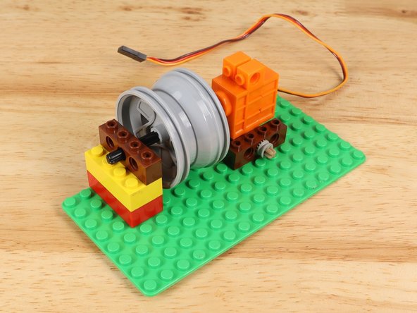 Once assembled place it on the baseplate to hold the axle in place.