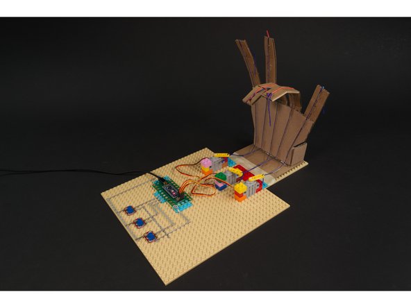 As you turn the potentiometers the fingers should start to close. If you turn the potentiometers back the fingers should return to an extended position.