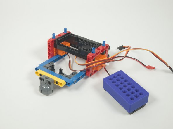 Place two black pins into the gray 90 degree connectors, facing upwards.