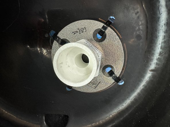 I used a flange and pipe fittings from the hardware store to make a connection for the pipe.