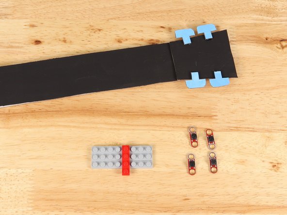 You can use any size of LEGO plates you would like as long as combined it is no more that 4 studs tall. Any taller and you will not have room for your tape paths on the remaining part of the neck. In the pictures our LEGO is 3x8.