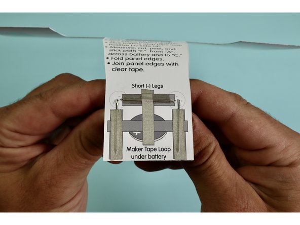 Measure, cut, peel, and stick a piece of Maker Tape down as indicated atop the letter 'A.'