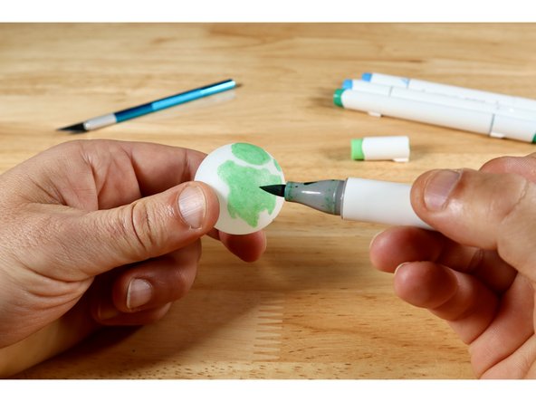 For added effect, its easy to create a fun back-lit topper for your ring by first using markers to color a white ping-pong ball whichever way you choose.