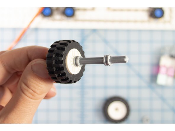 Use 3 bushings to keep two wheels in place, about 1 inch apart.