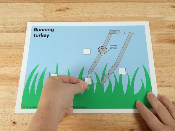 Add a piece of double-sided foam tape to the center of the background scene.