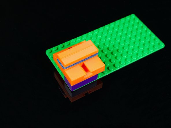 Make sure the PCB slots are on the inside, facing each other, and the “rubber band” slots are on the outside.