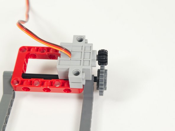 Make sure the gear is lined up and centered with the smaller gear that is on the servo.