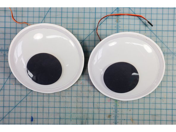 Glue the plastic domes in place with a glue stick.