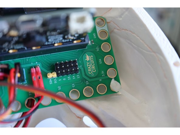 Download this code to the micro:bit in the skull.