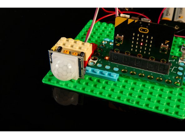 You'll want the PIR Sensor pointing in a direction where there is some open area. It can sit on the edge of your desk pointing towards the room your in, though it's best if no other people (or animals) are in the room when you test it in Step 9.