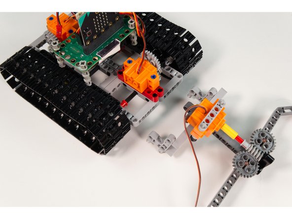 Attach the Gripper onto the front of the Tank.