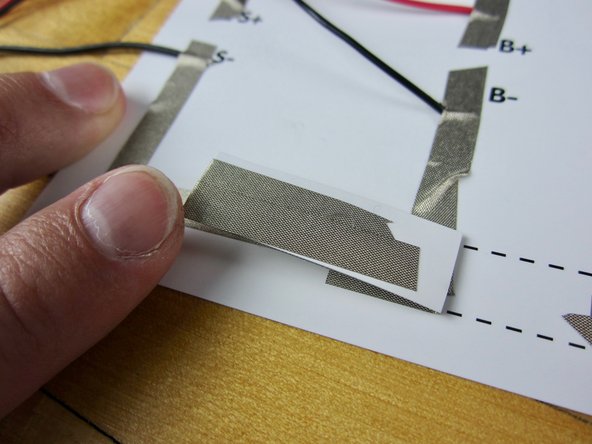 Run the tape up and around the back of the switch. Before you cut leave a long tail hanging off the end.