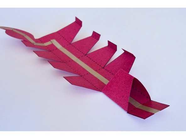 Fold and glue the first section of the tail to make a triangular shape as shown.