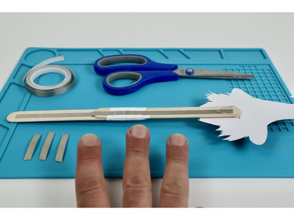 Measure and cut three pieces of Maker Tape that are approximately the same length as the Short LED Legs.