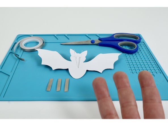 Measure and cut three pieces of Maker Tape that are approximately the length of the Long LED Legs.