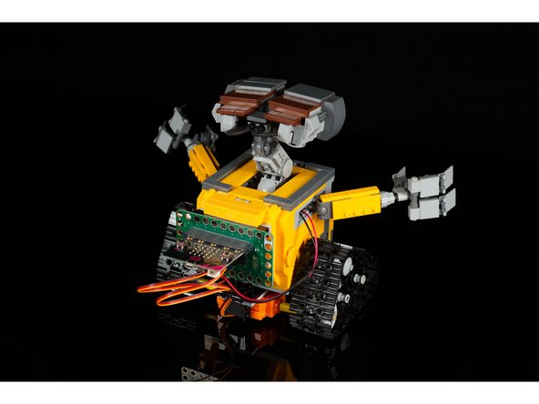 After you've got the code loaded, the servos plugged in, and connect the battery pack to the Bit Board WALL-E should start moving!