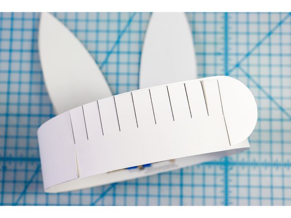 Interlock the slits in two places to create the size that works for your head.