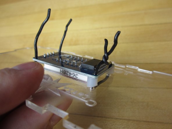 We used some Solid Core Wire to secure the display into place. Twist ties or zip ties would also work well.