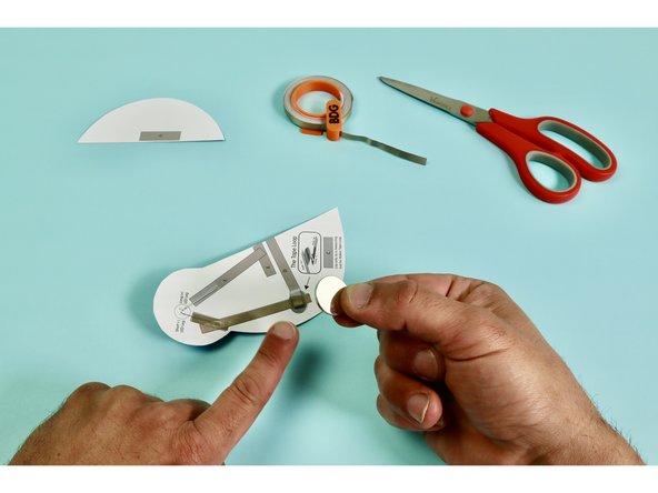 Stick the Battery atop the Tape Loop ‘C.’ with the Positive (+) Side up.