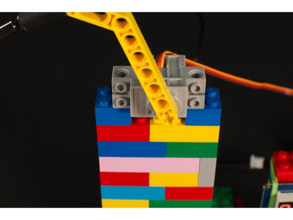 The LEGO compatible servo has holes that allow it to mount on its side and connect right to the studs on LEGO bricks.