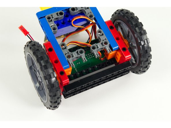 Turn the Rover upside down. We'll add two 90 degree connectors to the blue rear stabilizer beams as show.