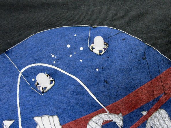 We then connected each LED to the common ground with a another line of thread.