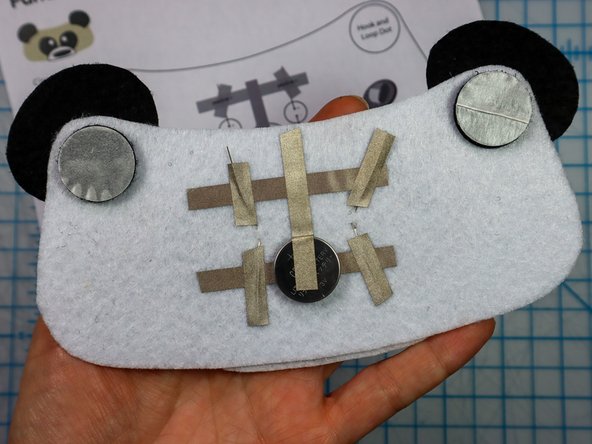 Then, peel the paper backing off of the other side and stick the design to the hat.