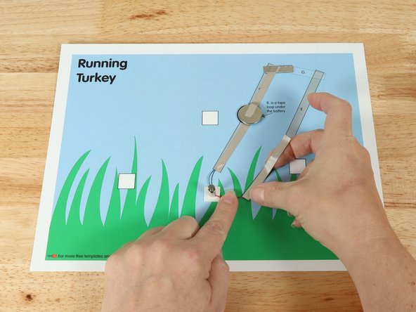 Add tape Path E. pressing it down atop the red wire.