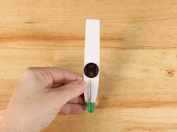 Make sure the Positive side of the Battery is facing upwards, with the Negative side stuck down to the tape.