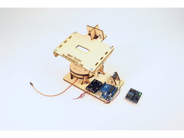 Find the Arduino shield and orient it to match the second photo.