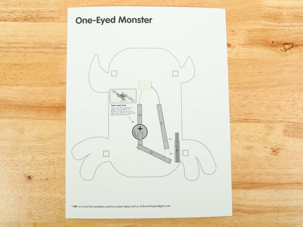 Add a piece of double-sided foam tape to the center of the bottom layer.